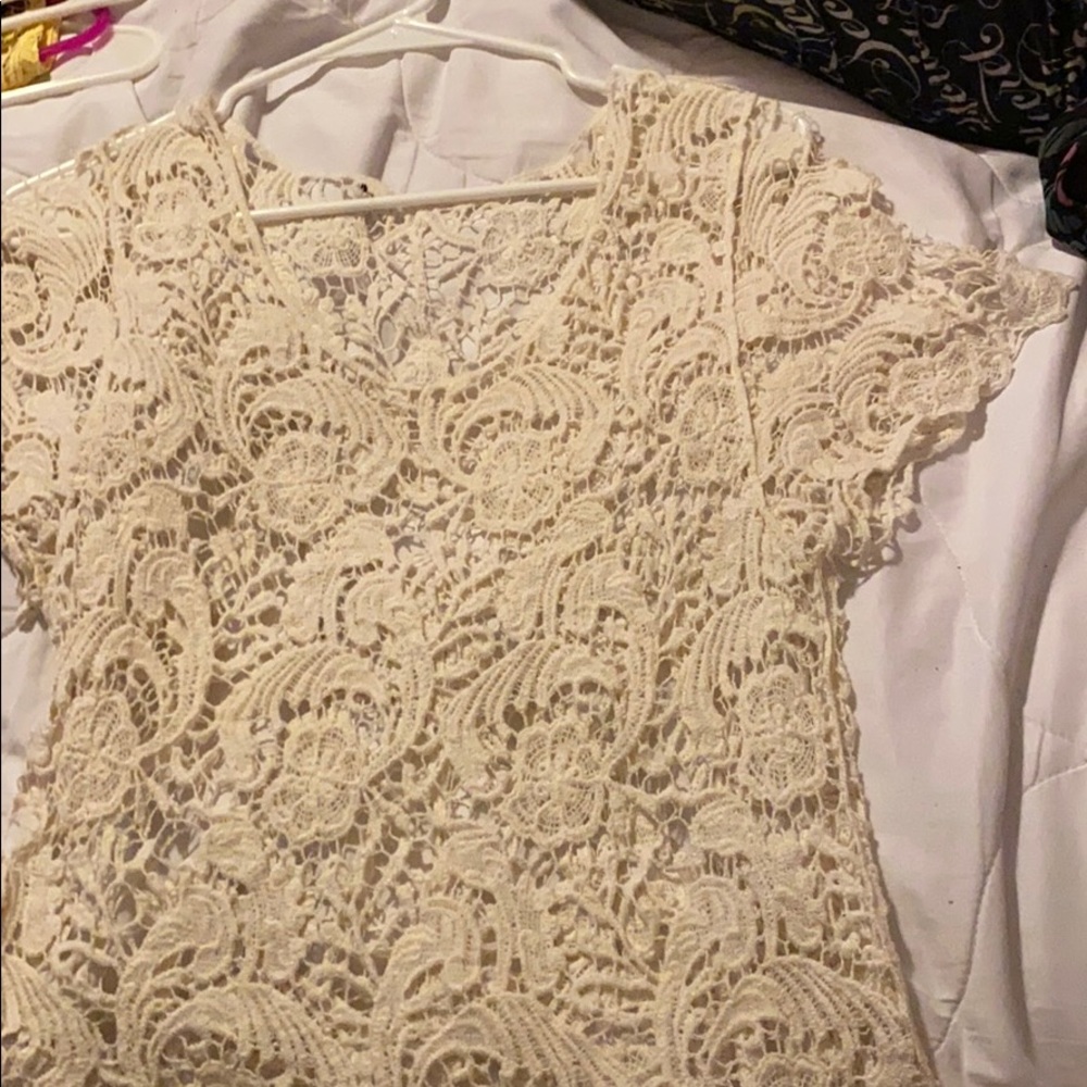 A cream short sleeve shirt